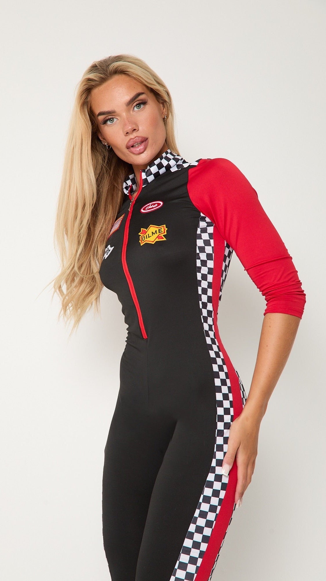Women’s race car driver jumpsuit costume with red sleeves and checkered stripes
