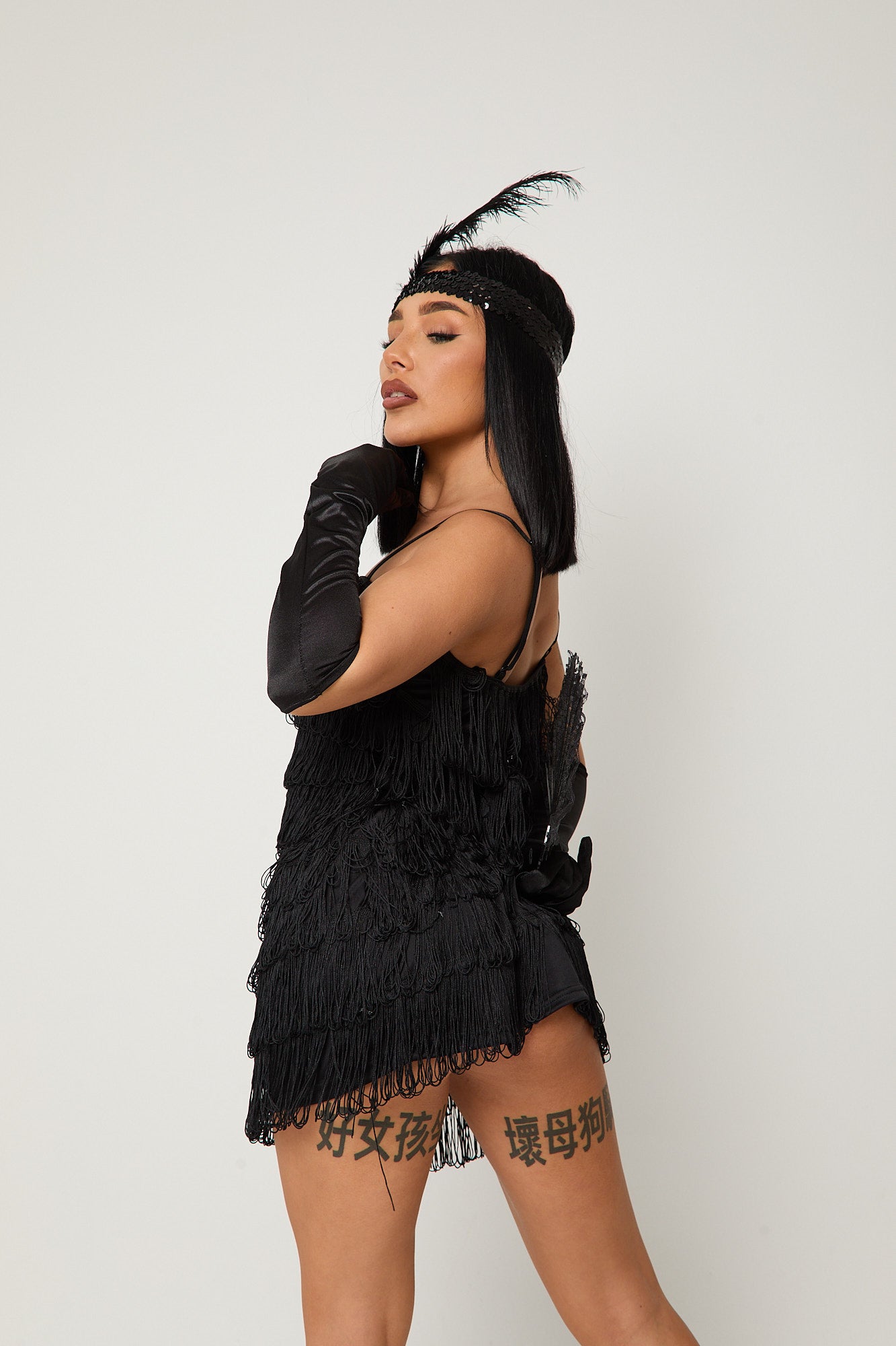 Sexy 1920s flapper costume with black sequin dress, gloves & feather headband – Dark Flapper by Been That Witch UK